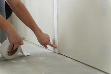 construction-worker-holding-tape-2048x1365 construction-worker-holding-tape-2048x1365